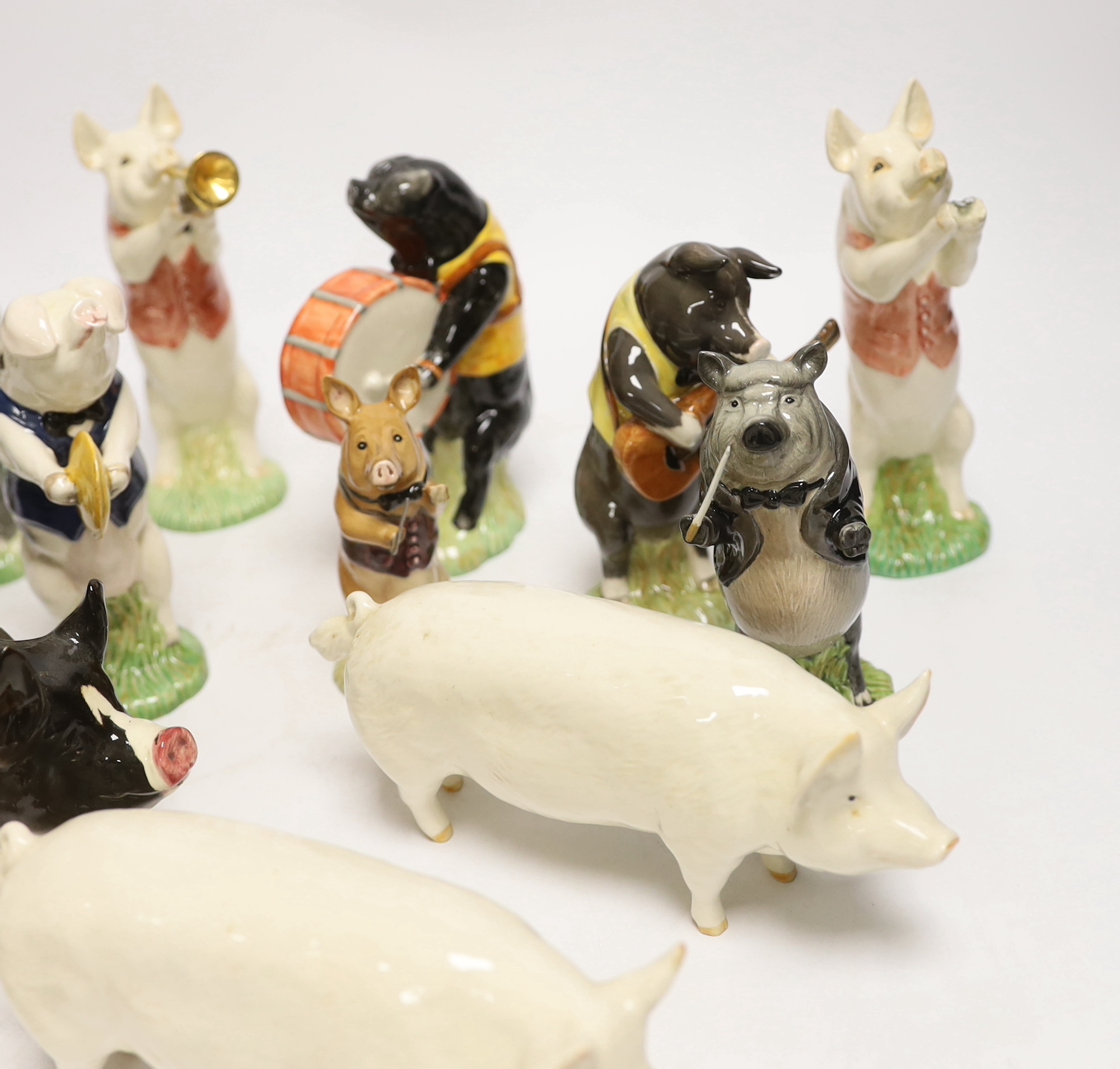 Five Beswick pigs and ten Beswick pig musician band figures